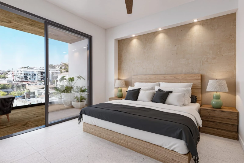 Primary bedroom with a private balcony in The Cosmopolitan apartment